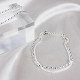 Set di bracciali eleganti in argento con pietre di zirconia