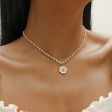 Collana con pendente a margherita di perla